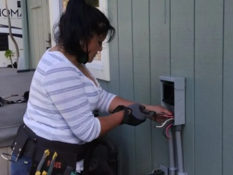 Licensed electrician wiring an exterior subpanel in Ferndale